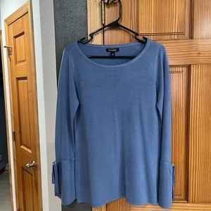 Light weight sweater with cute bell sleeves. New with tags. Color is periwinkle.